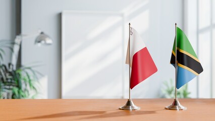 FLAGS OF MALTA AND TANZANIA ON TABLE