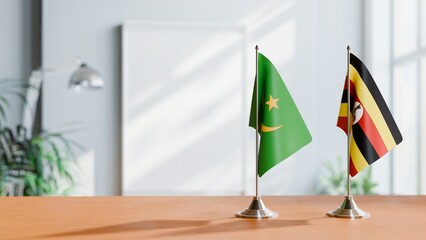 FLAGS OF MAURITANIA AND UGANDA ON TABLE