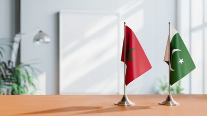 FLAGS OF MOROCCO AND PAKISTAN ON TABLE