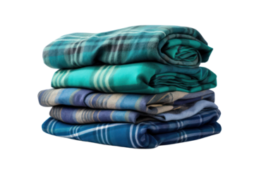 A stack of folded blue and green checkered flannel shirts with varying patterns, organized neatly isolated on white background