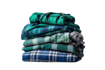 A stack of folded blue and green checkered flannel shirts with varying patterns, organized neatly isolated on white background