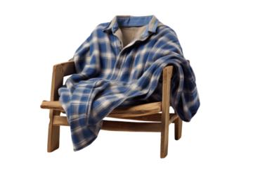 A flannel shirt draped over a wooden chair with a relaxed fit and soft fabric, highlighting the checked pattern isolated on white background