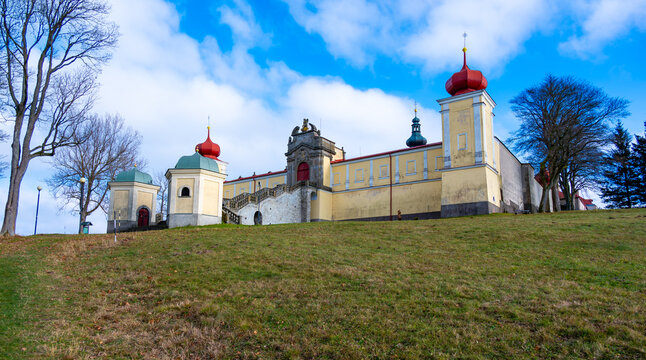 A beautiful view of the Monastery of Our Lady of the Mountain in Hedec, showcasing its historic architecture set against a tranquil natural backdrop, reflecting peace and spirituality