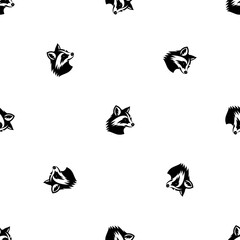 Seamless pattern of repeated black raccoon head symbols. Elements are evenly spaced and some are rotated. Illustration on transparent background