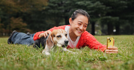 Selfie, outdoor and woman relaxing with dog for memory, social media or online post in woods....