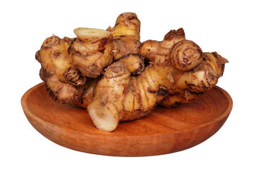 Galangal root on a wooden plate isolated transparent