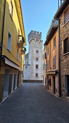 Fototapeta premium Sirmione, Italy - November 6, 2024: Scaliger Castle, the historic center of Sirmione, on the shores of Lake Garda.
