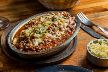 pasta with sauce and gratin cheese ready to eat