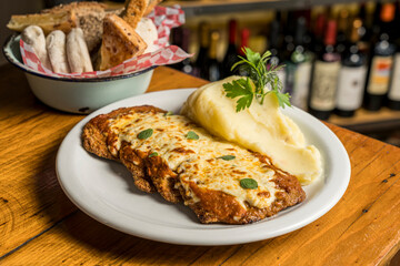 Milanese Neapolitan with mashed potatoes ready to eat