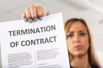 Businesswoman showing termination of contract notice