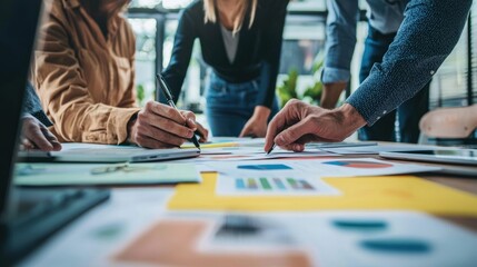 A group of professionals gathered around a table, collaborating and brainstorming ideas for a project