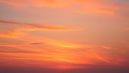 Fototapeta premium A dreamy sunset sky with hues of orange, pink, and purple blending into each other sea 