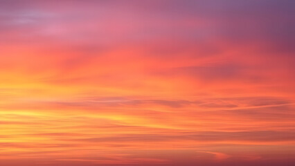 Obraz premium A dreamy sunset sky with hues of orange, pink, and purple blending into each other sea 