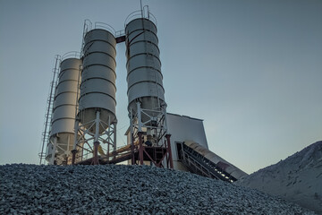 Construction industry concrete plant and equipment.Commercial concrete mixing plant of a cement factory. Concrete mixing silo,Industry manufacturing concept © faiz_99