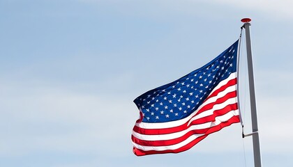 Fototapeta premium US flag flying against a clear sky background