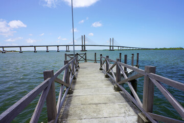 Obraz premium Pier in Aracaju with Ponte Joao Alves bridge on the background, Aracaju, Sergipe, Brazil