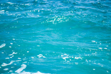 An abstract background of seawater flow under light exposure