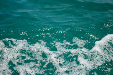 An abstract background of seawater flow under light exposure