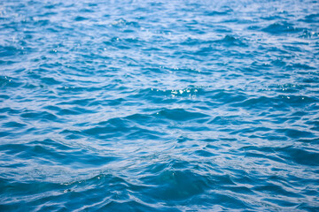 An abstract background of seawater flow under light exposure