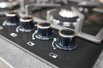 Black hob cooker oven grill control knobs selective focus over out of focus oven with burner...