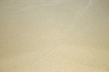 white beach sand texture background, footprints in the sand