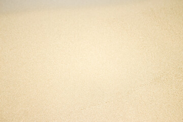 white beach sand texture background, footprints in the sand