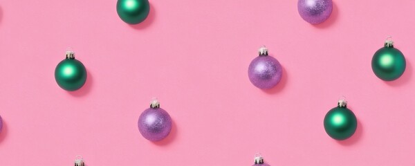 Colorful festive ornaments scattered on a pink background for holiday decoration