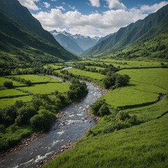 Fototapeta premium A small river cutting through a lush green valley, with mountains rising steeply on either side.