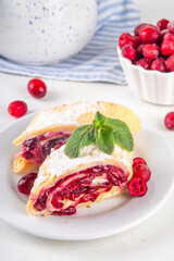 Cranberry strudel, winter rolled dessert cake with cranberry jam