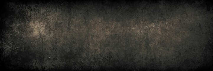 Fototapeta premium a textured background with a dark and somewhat grungy appearance. It has a mix of dark gray and black tones with some lighter, almost golden or brownish speckles and patches scattered throughout