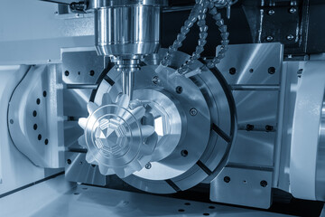 The 5-axis CNC milling machine  cutting the automotive part with solid ball end mill tool.