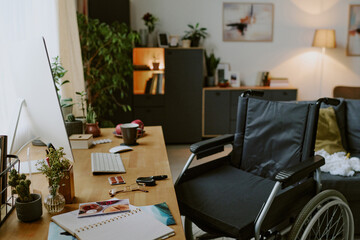 Cozy home office setup combining functional and aesthetic elements with wheelchair near desk,...