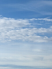 Big White Fluffy Clouds on A Blue Sky With Fine Whispy Lines