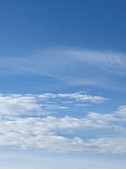 Big White Fluffy Clouds on A Blue Sky With Fine Whispy Lines