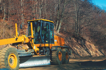 yellow tractor in the forest