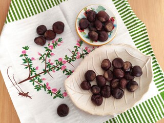 Shiny brown chestnuts on the table