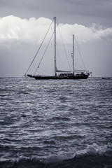 Fototapeta premium Sailboat on Calming Waters During Overcast Day 