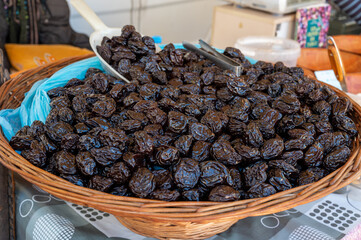 Bulk dried dehydrated black plums from Agen, France on local market in Biarritz