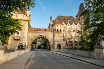 Fototapeta premium Budapest, Hungary. August 27, 2022. Shot walking towards the Gatehouse Tower entrance, warm late afternoon light illuminates the facade. We cross people, beautiful summer day. Travel destinations.