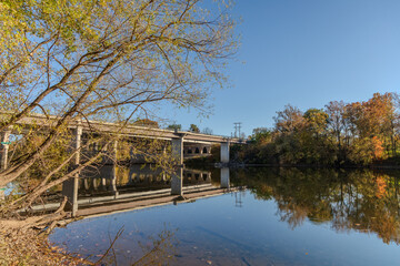 A bridge over a river with trees in the background