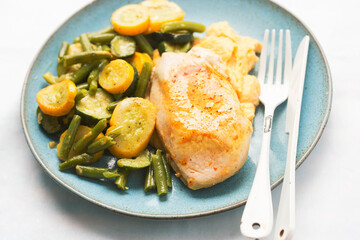 Grilled chicken breast with potato puree, courgette and beans