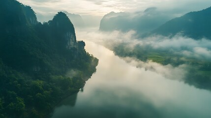 Misty River Valley Surrounded By Lush Green Mountains