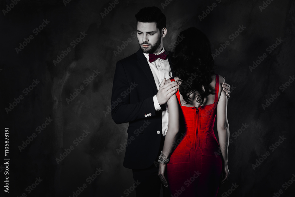 Poster rear view of pretty brunette woman with curly hair booty bum harsh man in tux with bow holding hands