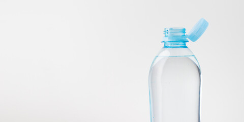 Bottle with a stationary plastic cap on a white background. The new design means the cap remains...