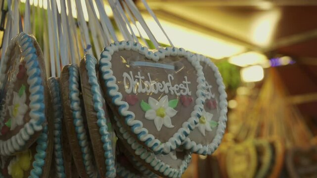 Munich, Germany. Sale of heart shaped gingerbread at Oktoberfest beer festival at Theresienwiese in Munchen, Bayern, Deutschland. Verkauf von Lebkuchen in Herzform auf Oktoberfest. 
