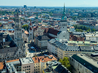 Beautiful aerial footage of Marienplatz the magestic New Town Hall, its clock and the Frauenkirche gothic church in the City of Munich Babaria Germany