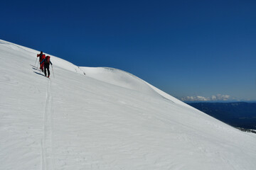 Climbing Llaima Vulcano with ski toptouring strong wind storm Chile