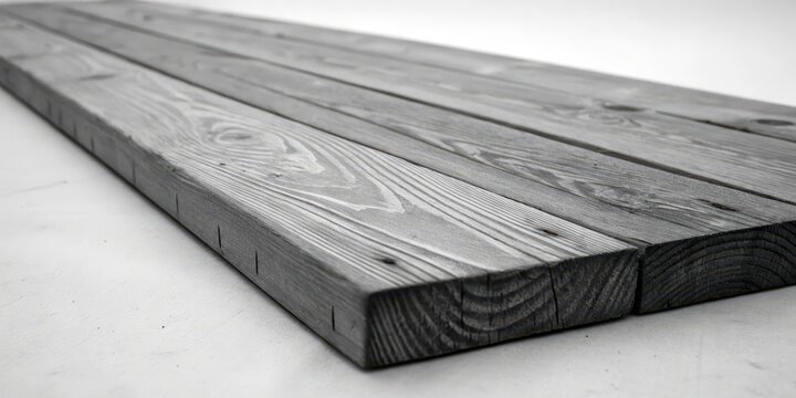Close-up view of rustic gray wooden planks arranged in a parallel pattern, showcasing the natural wood grain and texture
