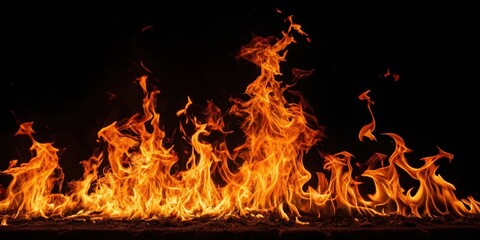 Fototapeta premium Fiery Inferno A Dramatic Display of Vivid Orange and Yellow Flames Against a Pitch Black Background