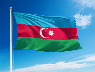 Azerbaijan flag waving in the wind against a blue sky background